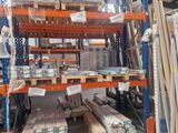 a large rack with many items in it in a warehouse