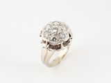 a close up of a diamond ring on a white background