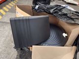 a pile of luggage sitting on a carton on the street