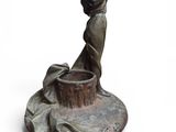 statue of a woman holding a pot on a pedestal