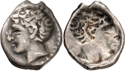 a silver coin with an image of a woman on it