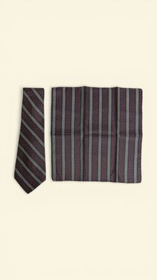 striped neck tie and pocket square on a white background