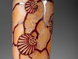 a vase that has a design on the inside of it