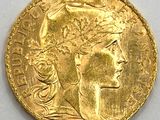 l'image d'une pièce d'or sur laquelle figure une tête de femme