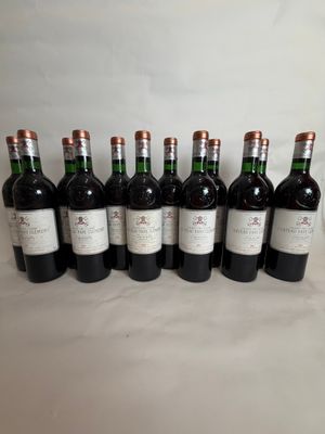six bottles of wine lined up in a row on a table