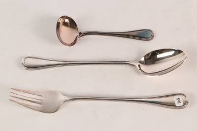three spoons and a fork on a white table