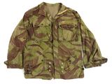 the jacket is camouflaged and has buttons on the chest