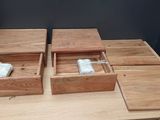 two wooden boxes that are sitting on a table