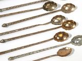 a lot of spoons that are sitting on a table
