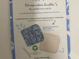 a tag with a picture of a blue and white flowered design on it