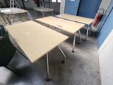 two tables and a chair in a room