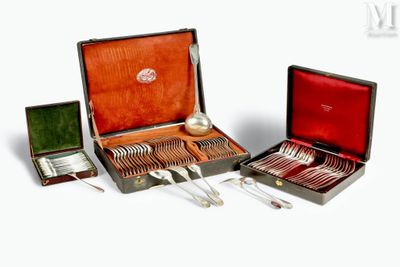 a box with silverware in it on a white surface