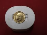 an image of a gold coin sitting on top of a white box