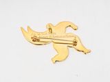 yellow gold plated brooch pin featuring a bird with a sword in its beak