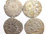 three silver coins, one of which has a face and the other of which has a head
