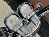 two gauges on the handlebars of a motorcycle