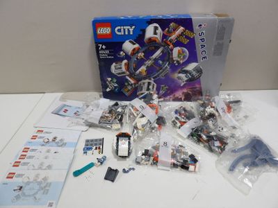a box of legos sitting on a table next to a box of legos