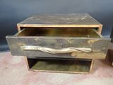 an old metal drawer with a handle on it