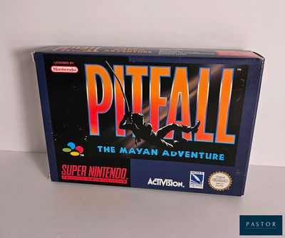 La boîte du jeu « Pitfall » est posée sur la table.