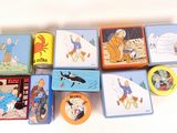 a lot of tins that are sitting on a table
