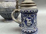 a blue and white pitcher and a blue and white coffee pot