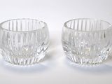 two glasses that are sitting next to each other on a table