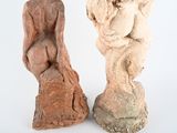 two sculptures that are sitting next to each other