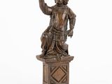 an image of a statue of a man holding a glass