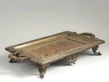 an antique brass tray with handles and handles on a white background