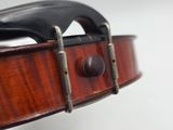 a close up of a violin with a bow on it