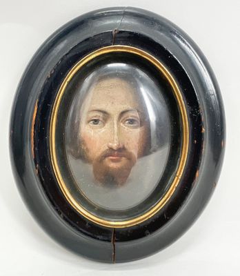 painting of a man with a beard and mustache in a black oval frame