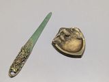 two spoons and a spoon rest on a table