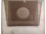 a glass plate with a circle on it on a table