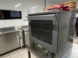 stainless steel counter top in a commercial kitchen with a toaster oven