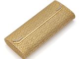 an image of a gold case sitting on top of a white surface