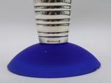 a blue lamp that is sitting on top of a table