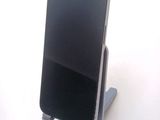 a cell phone that is sitting on a stand