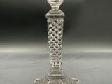 an image of a clear glass candle holder on a table
