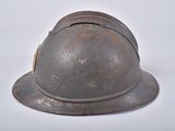 a helmet that is sitting on a white surface