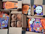several boxes of halloween items are sitting on the floor