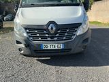 the front of a white van parked in a parking lot