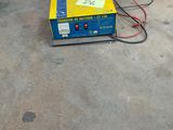 a blue barrel and a yellow box on the floor