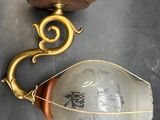 a light that is hanging on the wall next to a lamp