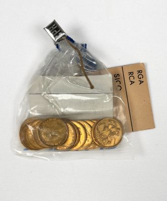 a bag of gold coins and a piece of paper on a table