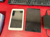 several electronic devices are sitting on a red table next to a keyboard and mouse