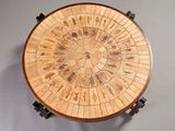 an image of a wooden table with a circular design on it