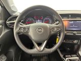 the interior of a car with a steering wheel and dashboard controls
