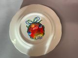 a white plate with a christmas ornament on it