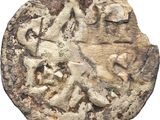a close up of a coin with a horse and rider on it