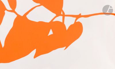 a picture of an orange leaf on a branch